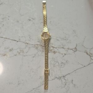 Vintage Sergio Valente Gold Women's Watch with Textured Band